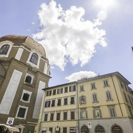 Beneath The Elegant Silhouette Of Duomo